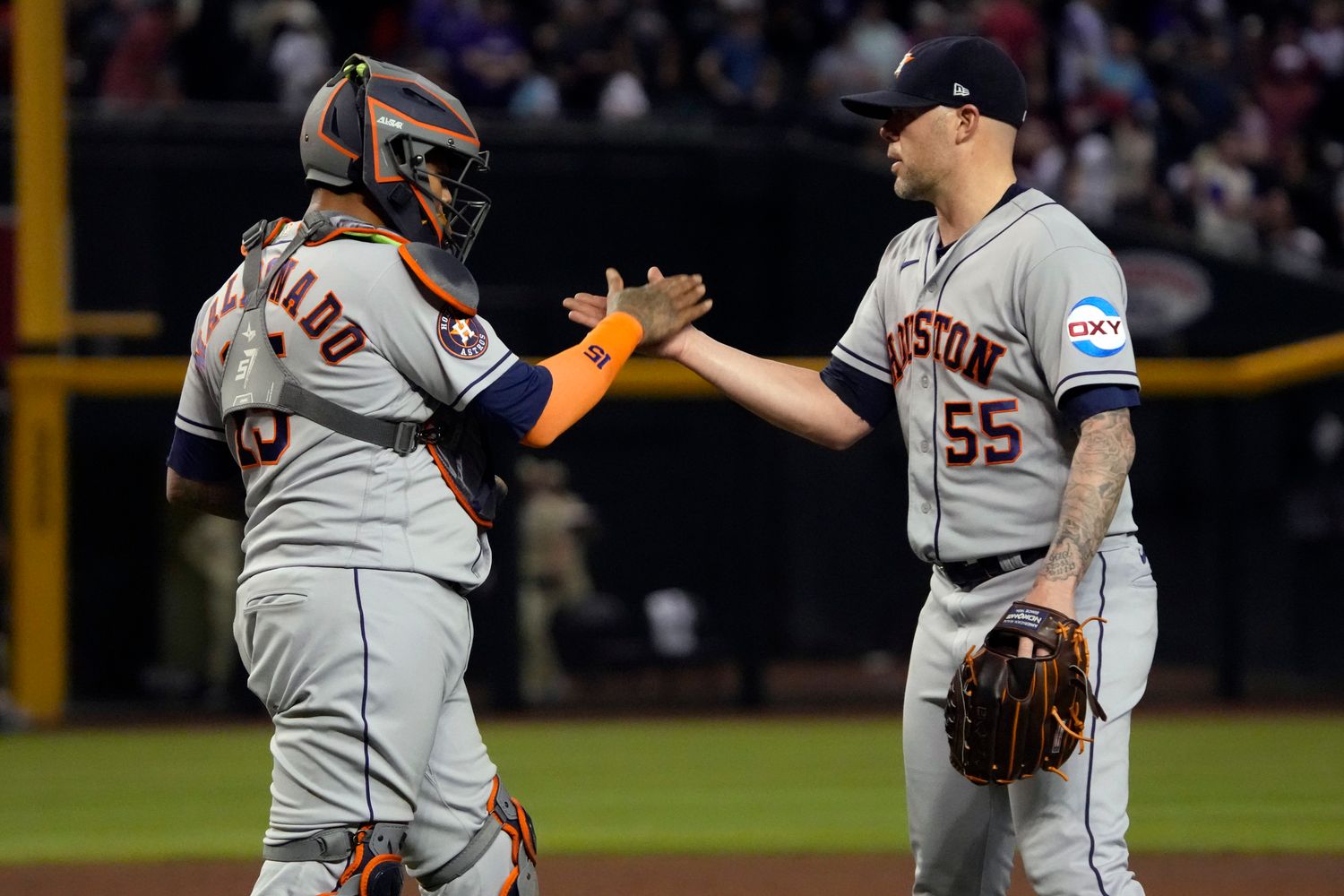 Sep 29, 2023; Phoenix, Arizona, USA; Houston Astros catcher Martin Maldonado (15) and pitcher Ryan Pressly (55) celebrates after defeating the Arizona Diamondbacks at Chase Field. Mandatory Credit: Rick Scuteri-USA TODAY Sports  
